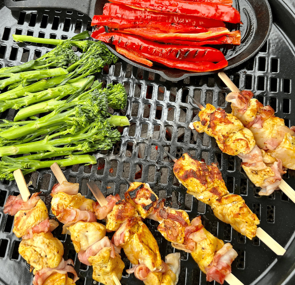 Delicious food on the BBQ outdoor cooking stove with the cast iron grill pan