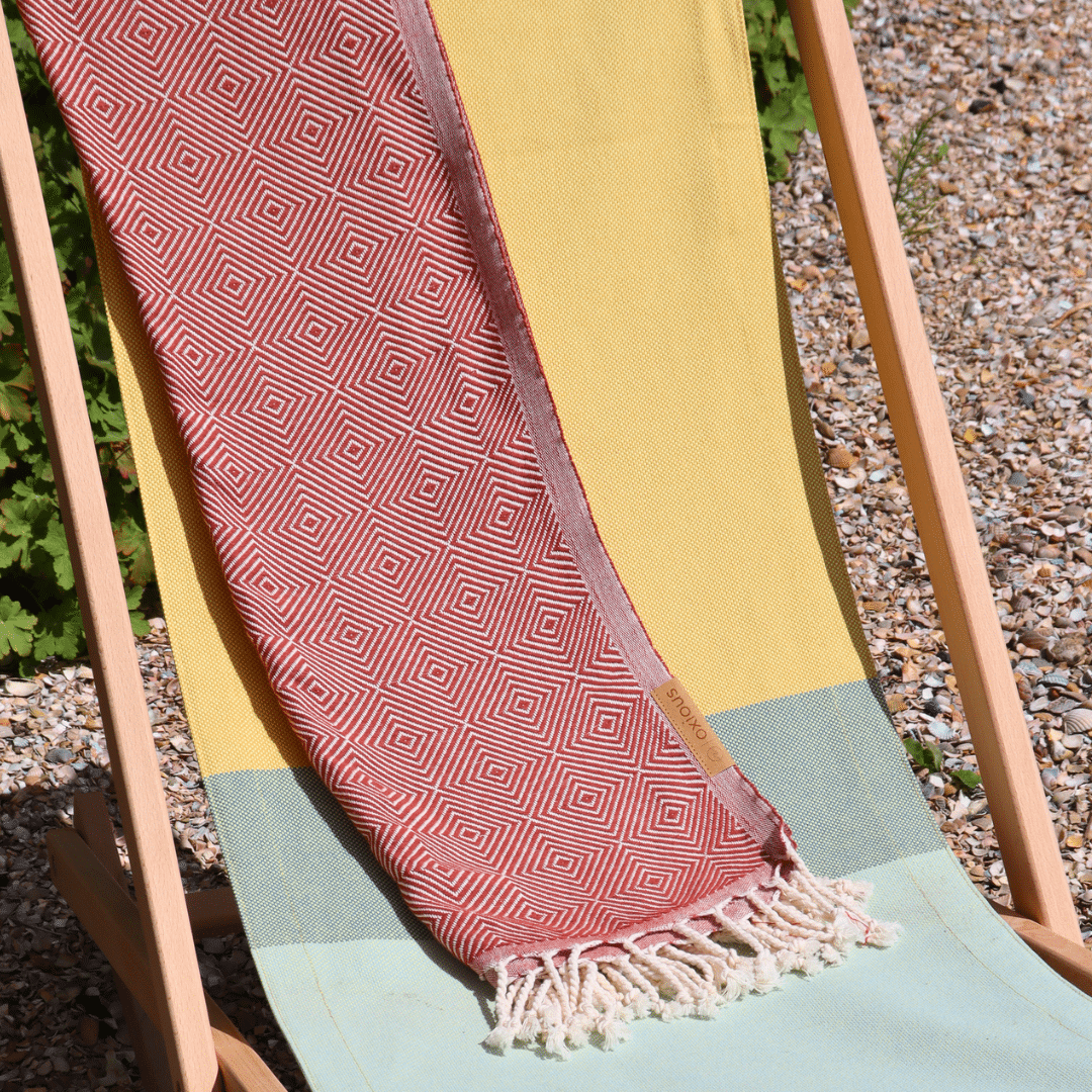 beach chair yellow with hamam towel brick